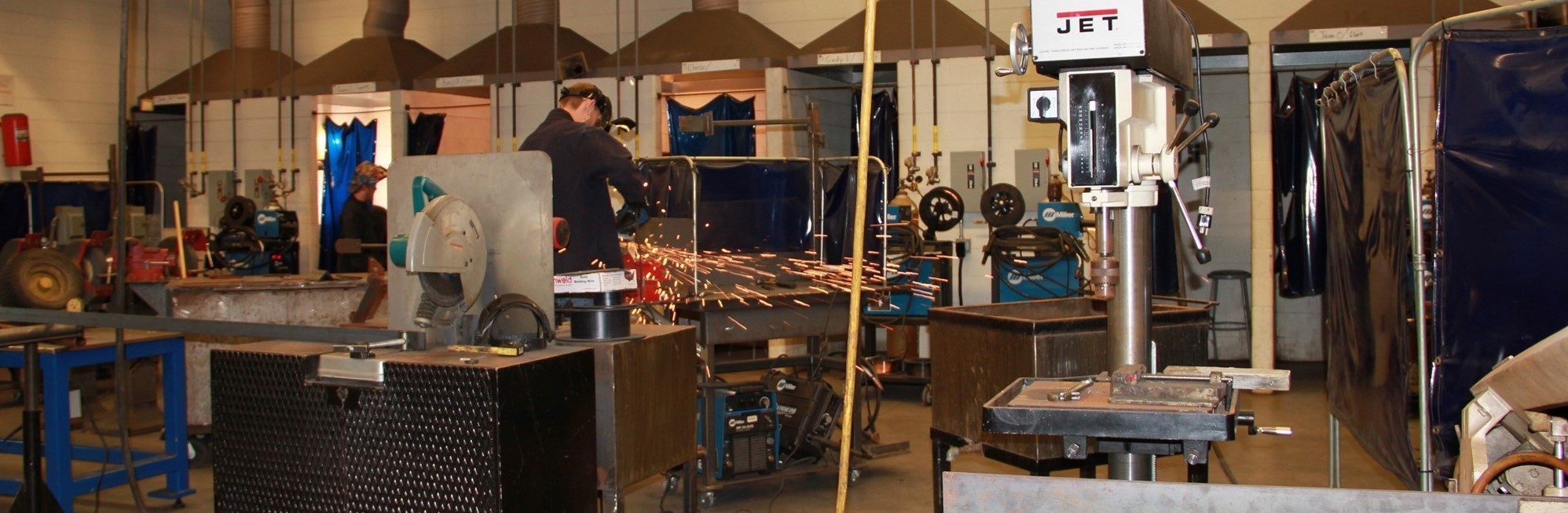 Student welding in shop