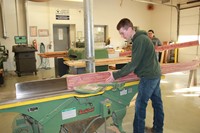 Student planing wood